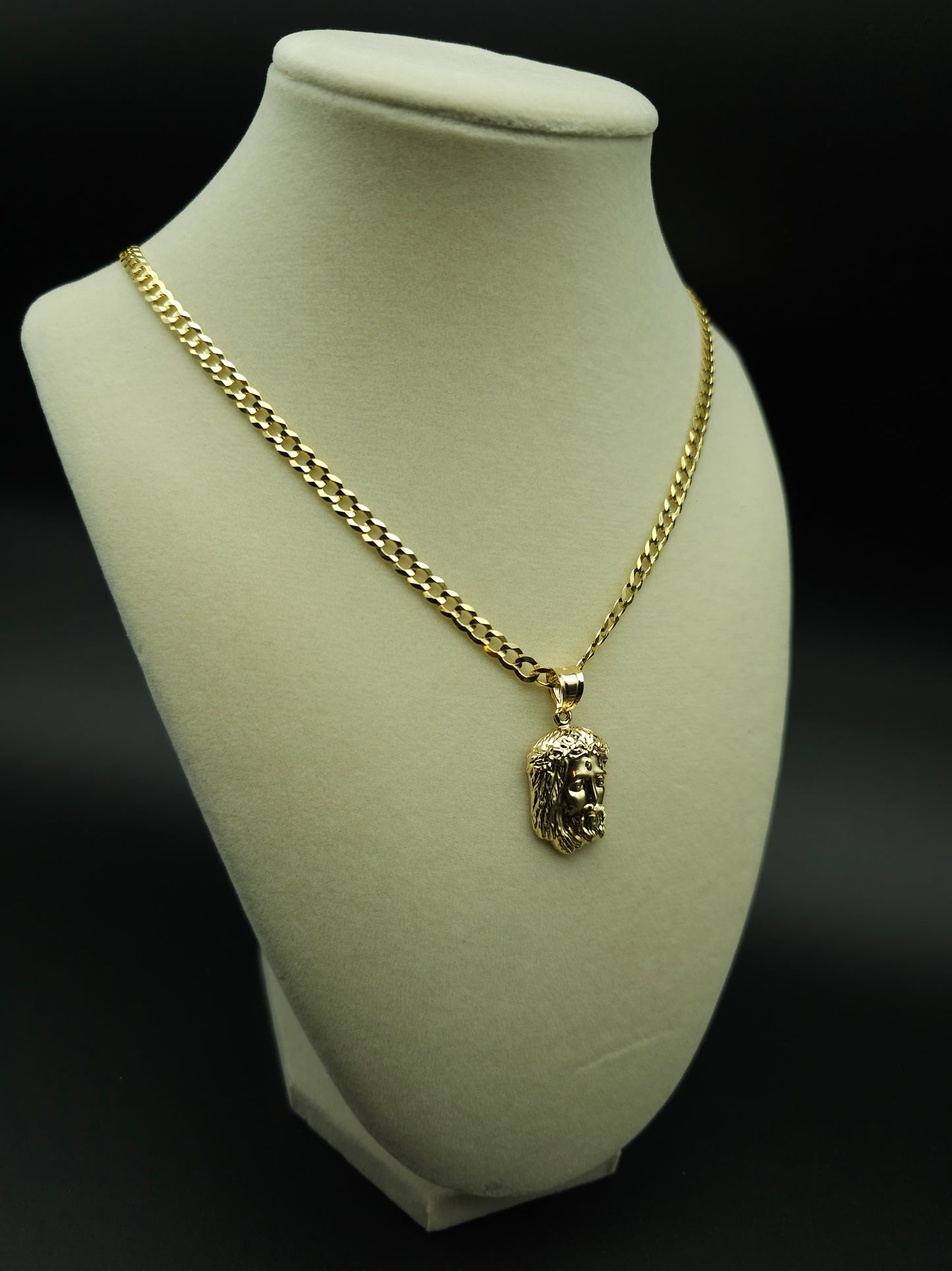 Elevate your style with this Solid Gold Cuban Chain featuring a Jesus Face Pendant. Perfect for anyone seeking a bold and timeless accessory. Shop now at Ken’s Virtual Store Jewelry